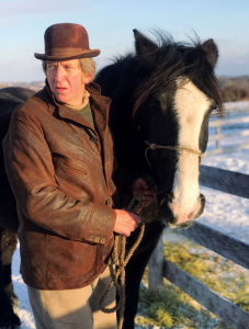 Thompson with Barney the horse in a paddock in winter