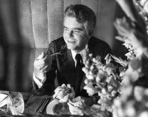 Roloff Beny in his Rome apartment, 1971 seated. eating