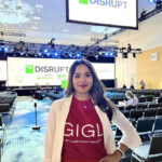 Disha Nayak Entrepreneur standing at the Disrupt conference