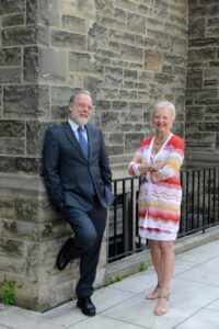 Michael Ratcliffe (left) and Anne Steacy standing together at Trinity College